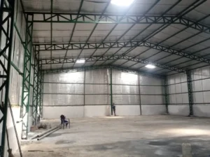 Insulated pre-engineered steel warehouse building with structural steel frame for industrial manufacturing logistics and cold storage applications