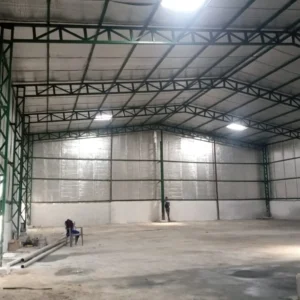 Insulated pre-engineered steel warehouse building with structural steel frame for industrial manufacturing logistics and cold storage applications