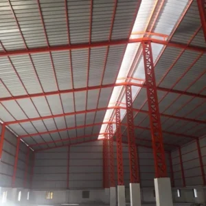 Pre-engineered steel warehouse building with structural steel framework for industrial storage manufacturing and logistics applications